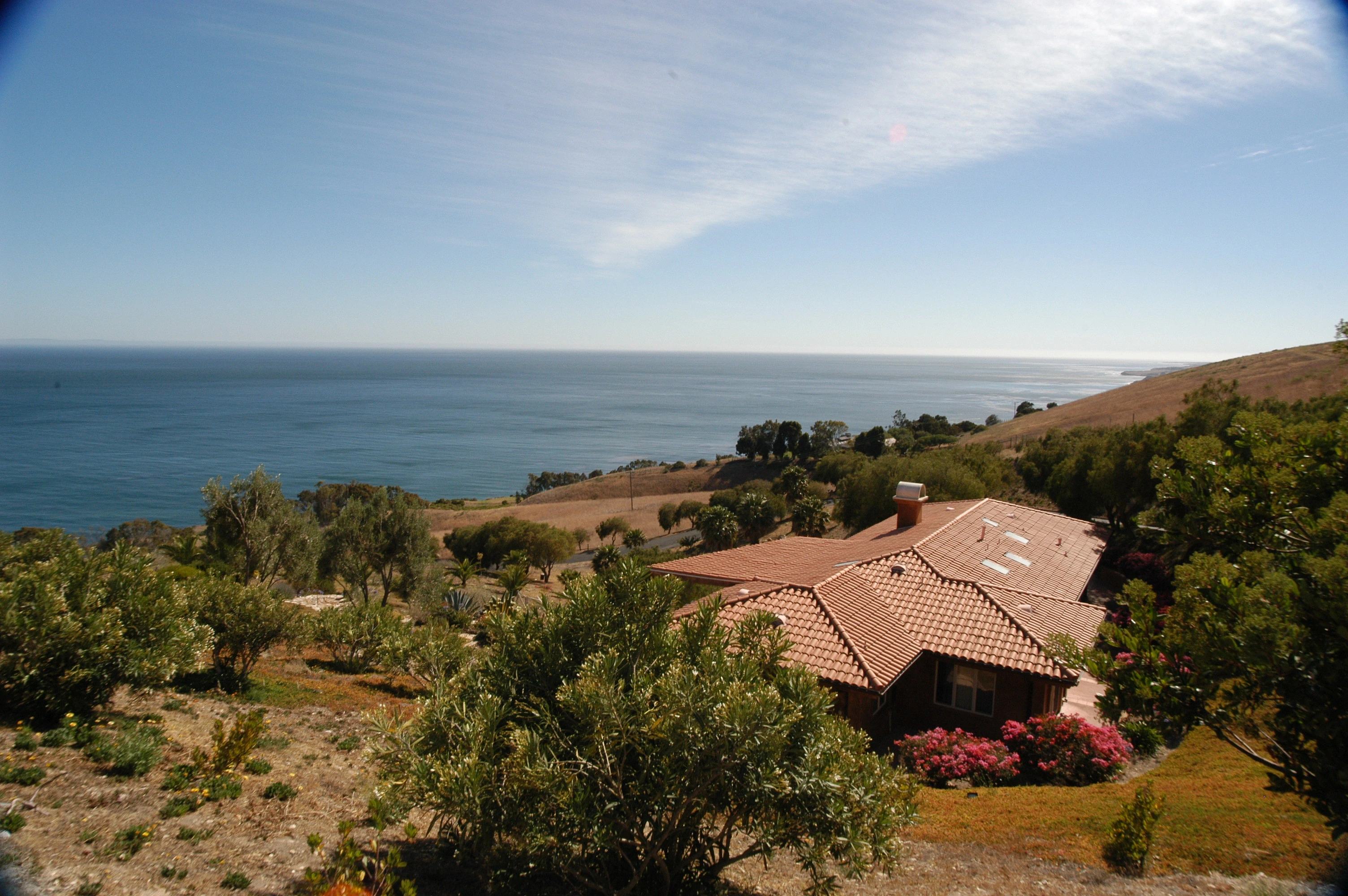 The residence and coastline from above